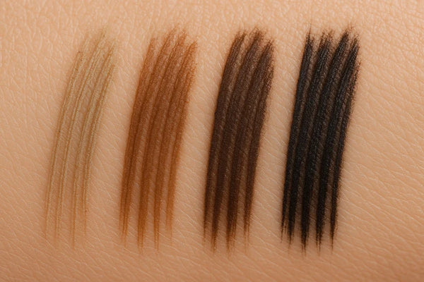 Brow Theory Pro Water Resistant Precision Eyebrow Pencil shade range in Blonde, Medium Brown, Dark Brown, and Ebony.